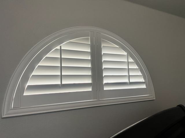 Half-round plantation shutters