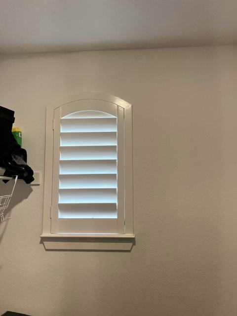 Small arched plantation shutter